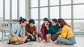 Group of Asia young creative people in casual wear discussing business brainstorm meeting ideas mobile application software design Royalty Free Stock Photo