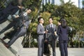 Group of asian business people standing chatting on street Royalty Free Stock Photo