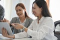 A group of Asian businesspeople or office workers are having a meeting in the office Royalty Free Stock Photo