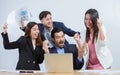 Group of Asian and Caucasian business people wearing formal suits, surprise and very happy with their success on their projects Royalty Free Stock Photo