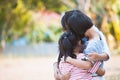 Group of asian children hugging and playing together Royalty Free Stock Photo