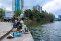 Group of Asian Chinese man fishing in pond