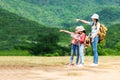 Group asian family children checking map and pointing in the jungle adventure and tourism for destination leisure trips for educat Royalty Free Stock Photo