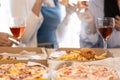 Group of Asian female friends at a party Have a fun time together. pizza party wine drinks