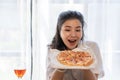 Group of Asian female friends at a party Have a fun time together. pizza party wine drinks