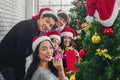 Group of asian friends celebrating christmas or new years party together at home