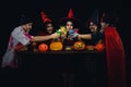 Group of asian friends in spooky costume having fun in halloween celebration party at nightclub and clinking cocktail together Royalty Free Stock Photo