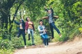 Group asian friends traveler with backpack adventure happy and jumping relax