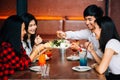 Group of Asian happy and smiling young man and women having a meal together with happiness Royalty Free Stock Photo