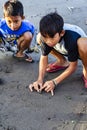 Asian kids playing marbles traditional games