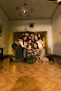 a group of Asian people hanging out with their friends in an old room while on vacation together Royalty Free Stock Photo