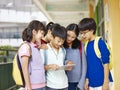 Group of asian pupils using tablet computer at school Royalty Free Stock Photo