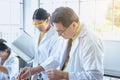 Group of asian scientist working and explaining research information together in the laboratary Royalty Free Stock Photo