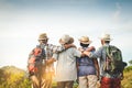 A group of Asian elders climbing and standing on the mountains