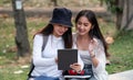 Group Of Asian Students Or Preparing For Lectures Outdoor, Studying With Tablet. Royalty Free Stock Photo