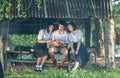 Group of Asian students in uniform studying together