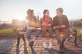 Group of Asian teenage students schoolchildren sitting on a bench in the park and preparing exams Royalty Free Stock Photo