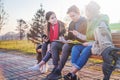 Group of Asian teenage students schoolchildren sitting on a bench in the park and preparing exams Royalty Free Stock Photo