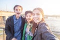 Group of Asian teens taking selfie on phone, having fun, best friends and digital generation concept Royalty Free Stock Photo