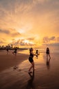 a group of Asian women dancing together and full of joy on the beach Royalty Free Stock Photo