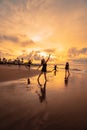 a group of Asian women dancing together and full of joy on the beach Royalty Free Stock Photo