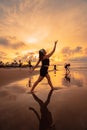 a group of Asian women dancing together and full of joy on the beach Royalty Free Stock Photo