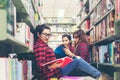Group asian women in library reading something Royalty Free Stock Photo