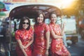 Group of asian woman wearing chinese tradition clothes toothy smiling face happiness emotion and hand sign i love you