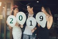 Group of asian young people holding balloon numbers 2019, Celebration New year concept.