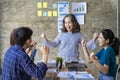 A group of Asian youths with a creative team leader. Have fun laughing Royalty Free Stock Photo