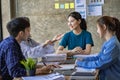 A group of Asian youths with a creative team leader. Have fun laughing Royalty Free Stock Photo