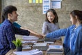 A group of Asian youths with a creative team leader. Have fun laughing Royalty Free Stock Photo