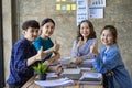 A group of Asian youths with a creative team leader. Have fun laughing Royalty Free Stock Photo