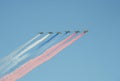 A group of assault plane Sukhoi Su-25 Grach NATO reporting name: `Frogfoot` in the sky smoke colors of Russian flag at the rehea