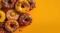 Group of assorted donuts. Chocolate, pink, yellow, green and red on colored background.