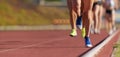 Group of athletes sprinters run speed on track