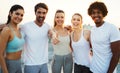 Group of athletic young people, friends in sportswear doing exercises. Sport outdoors Royalty Free Stock Photo