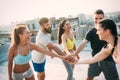 Group of happy fit young people friends in sportswear doing exercises . Sport outdoors Royalty Free Stock Photo