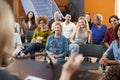 Group Attending Neighborhood Meeting Listening To Speaker In Community Center Royalty Free Stock Photo