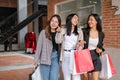 Group of attractive Asian girls with shopping bags are enjoying shopping in the city Royalty Free Stock Photo