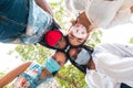 Group of attractive young women of different ethnics hugging in a circle