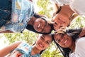 Group of attractive young women of different ethnics hugging in a circle