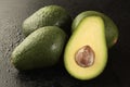 Group of avocado with half on black background Royalty Free Stock Photo