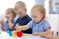 Group of babies kids engaged in handcrafts Royalty Free Stock Photo