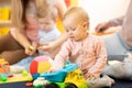Group of babies with mothers at playgroup Royalty Free Stock Photo