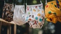 A group of baby diapers hanging from a clothes line. Generative AI image.