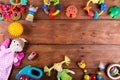 Group of baby toys on wooden background with copy space. top vie Royalty Free Stock Photo