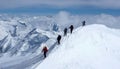Group of backcountry skiers on a ski mountaineering tour in the Austrian Alps heading to the summit of Grossvenediger Royalty Free Stock Photo