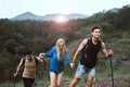Group of backpackers best friends getting help together,Helping hand,Overcoming obstacle concept Royalty Free Stock Photo
