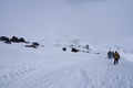 Group of backpackers going down the mountain through snowstorm Royalty Free Stock Photo